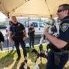 UCPD officer holding a goat.